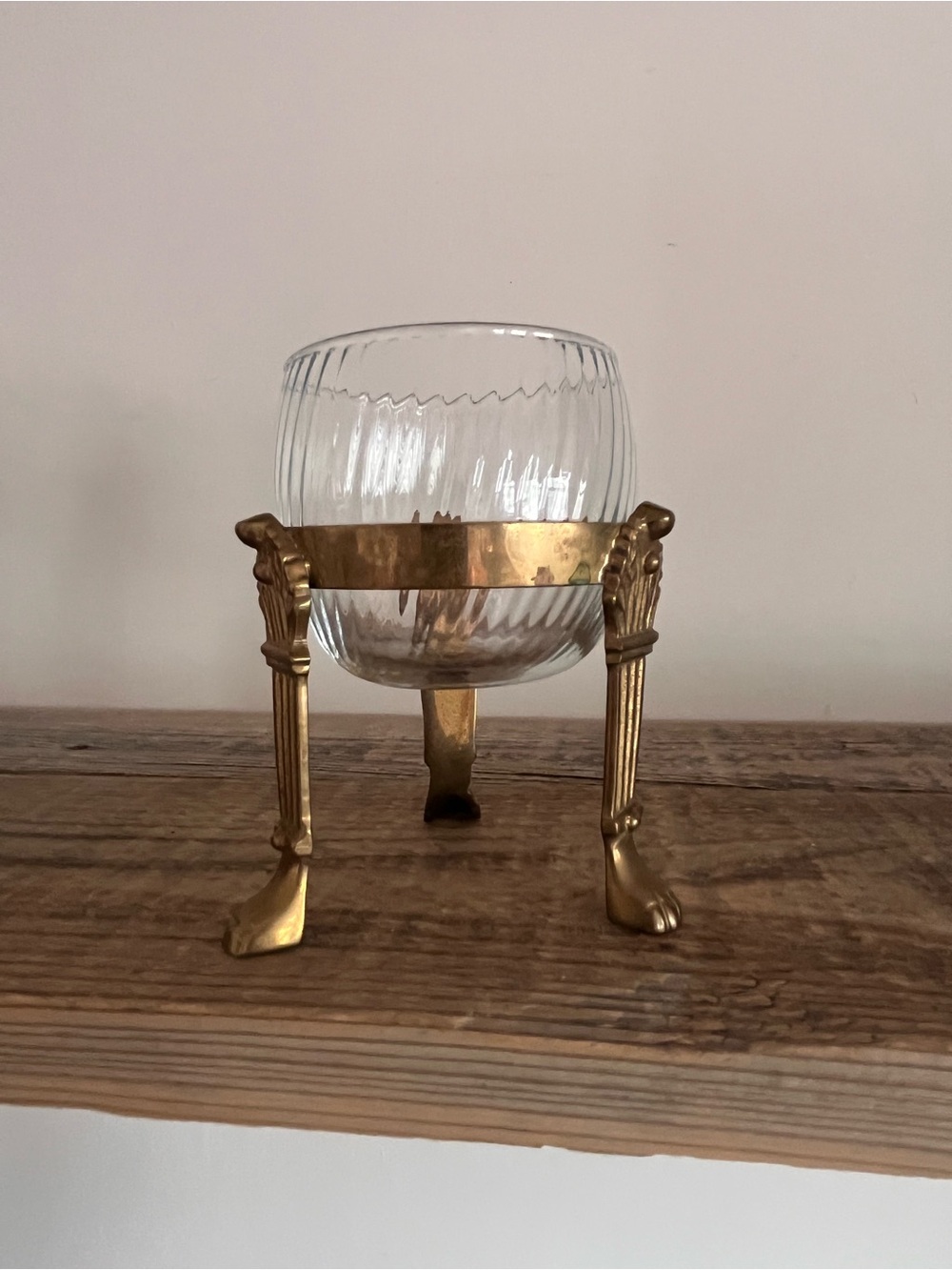Brass footed stand with glass votive